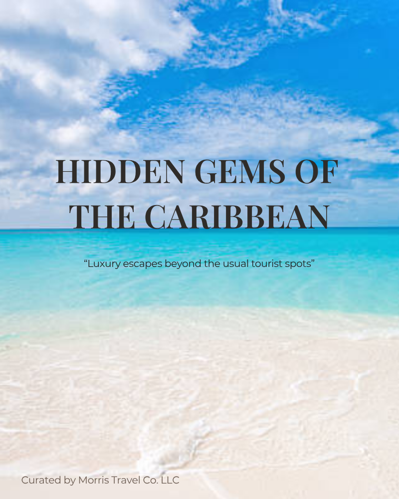 Bright tropical beach with white sand, turquoise sea, and blue sky with scattered clouds.